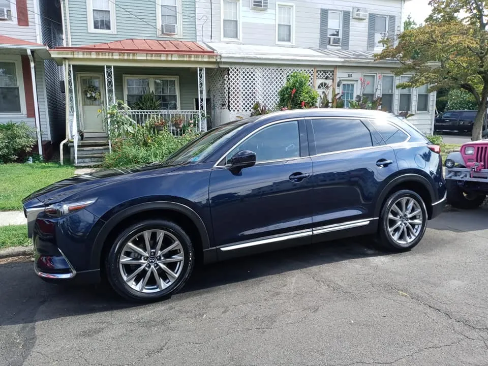 Dark blue Mazda CX-9 detailed to a high shine